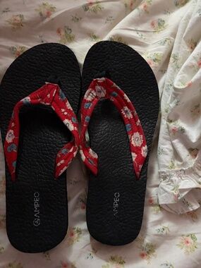 Red and black flip flops